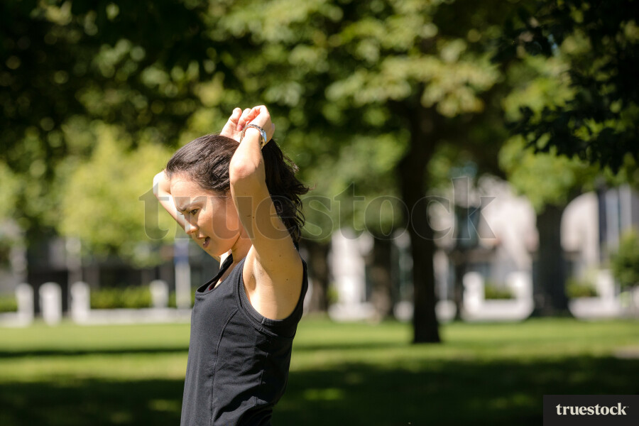 Female doing yoga in a park