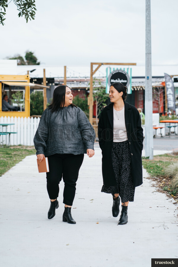 Colleagues Talking While Walking