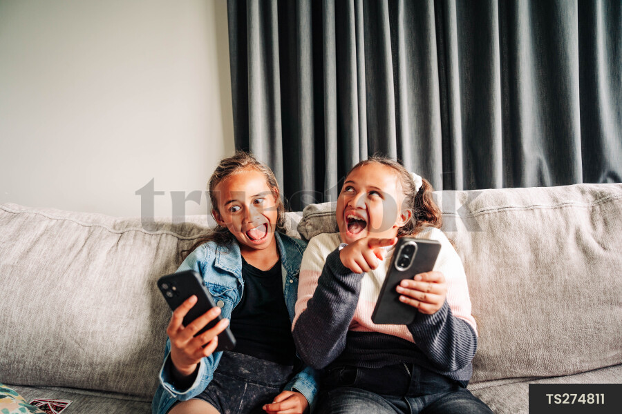 Girls sitting on sofa