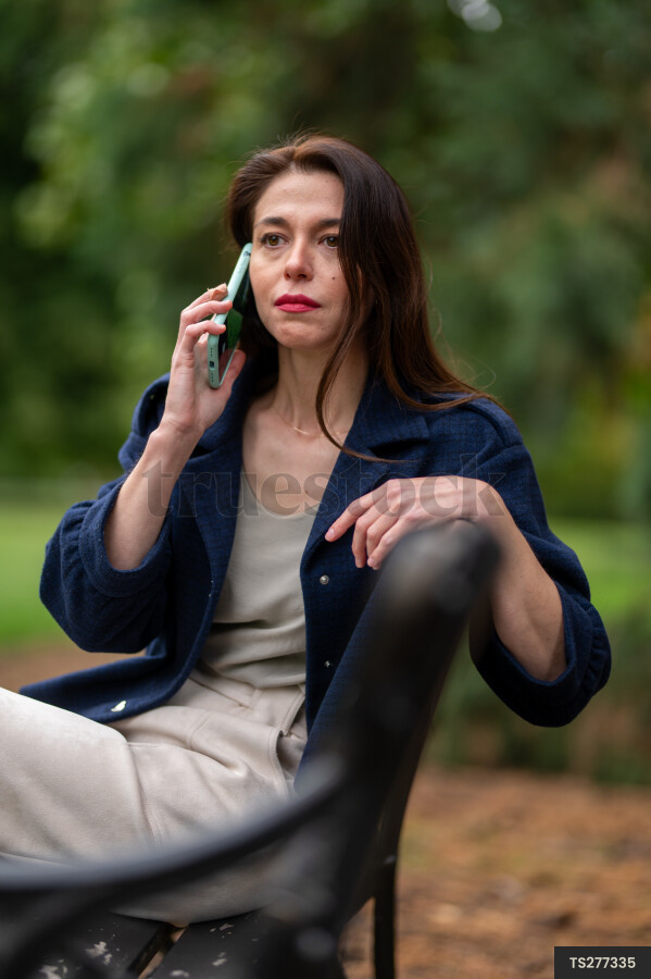 Woman sitting on park bench