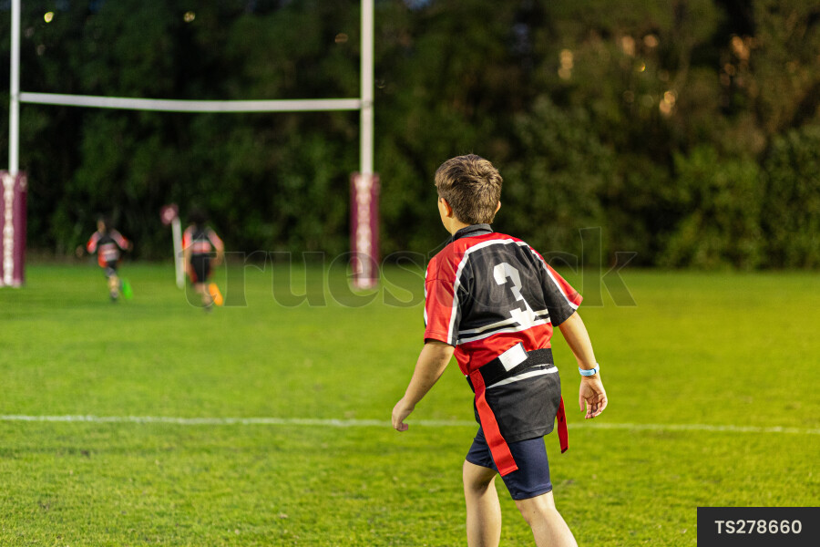 TS278660 Boy playing rugby on field by Fraser Tebbutt - Truestock