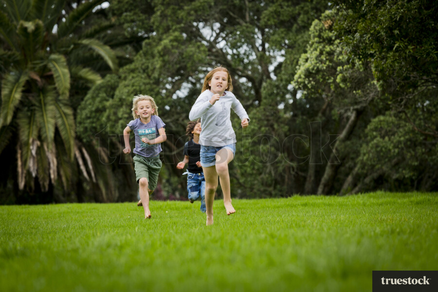 Children running on field