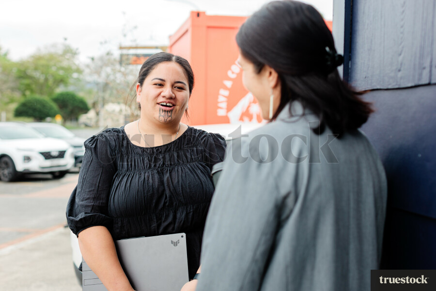 Colleagues Talking While Walking