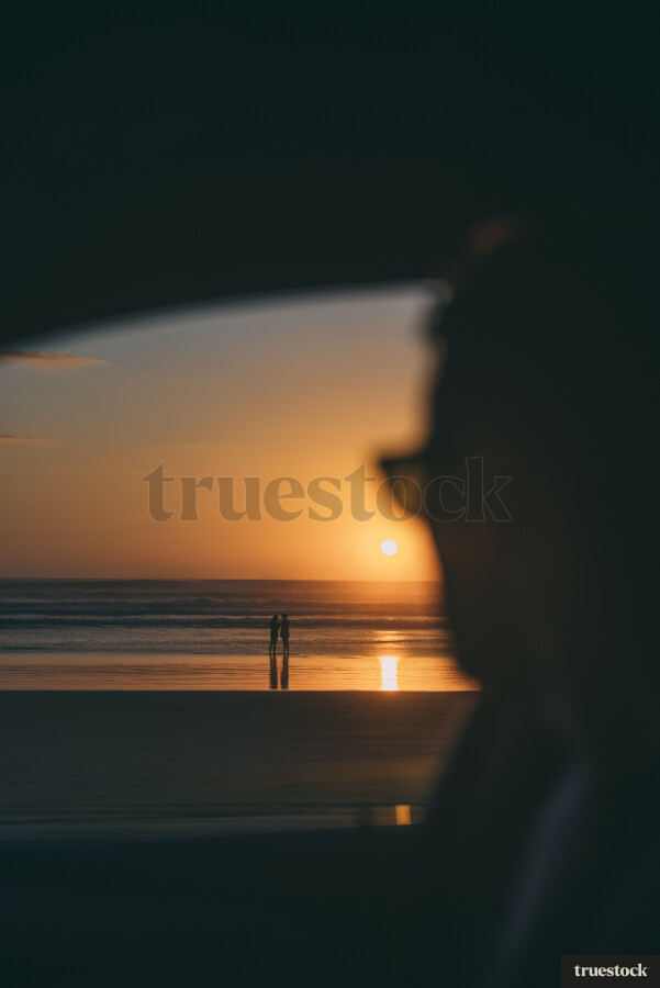 Driving on the beach at sunset