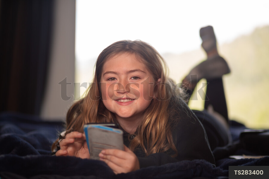 Teen Girl on Phone in Room