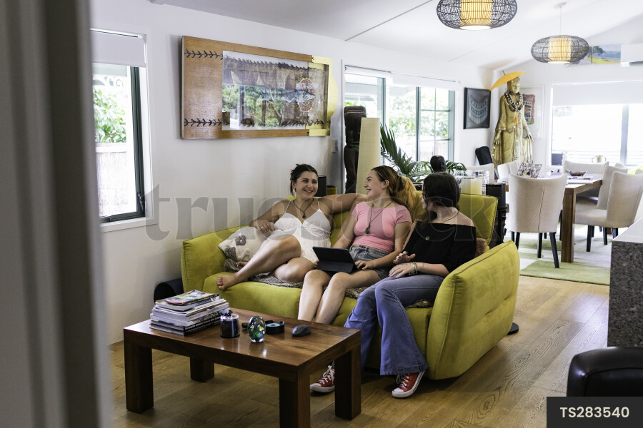 Friends sitting on sofa