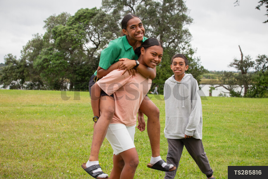 Girls and boy in park