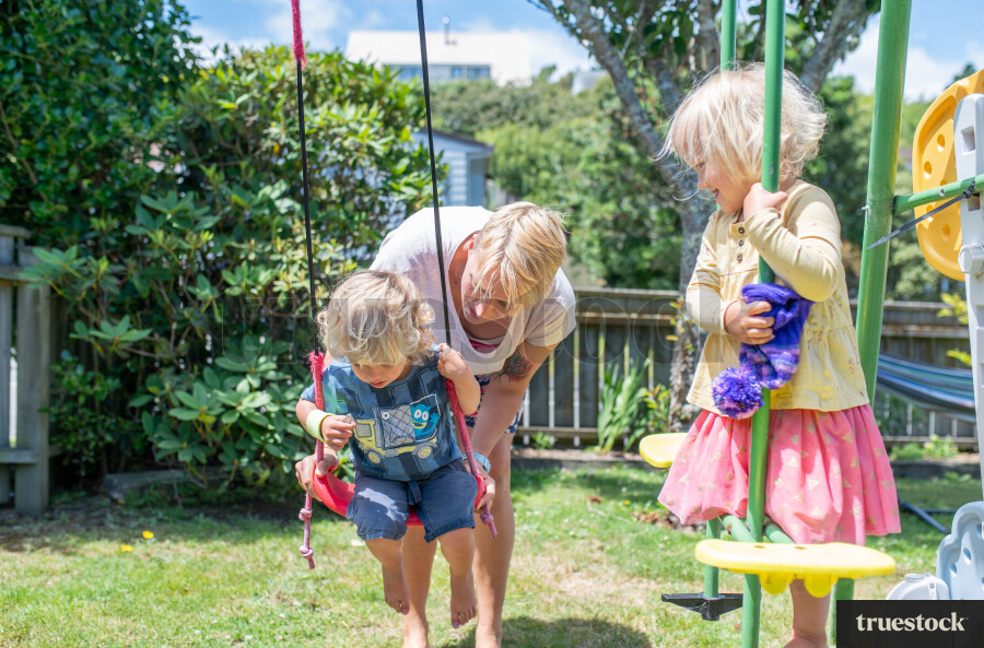 Mother and Kids on Swingset