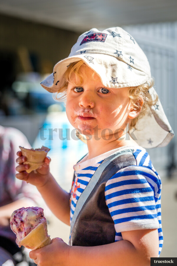 Toddler eating an ice cream