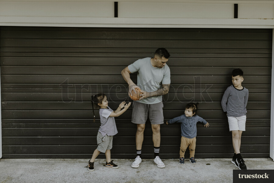 Dad Playing Basketball with Kids