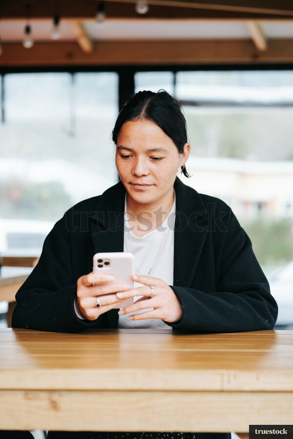 Woman Using Phone During Break
