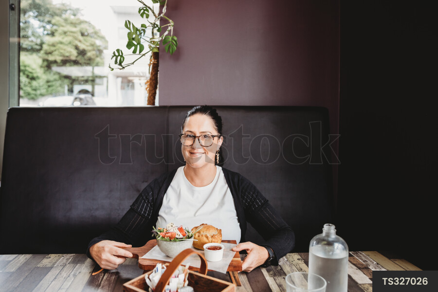 Customer Receiving Food at Cafe