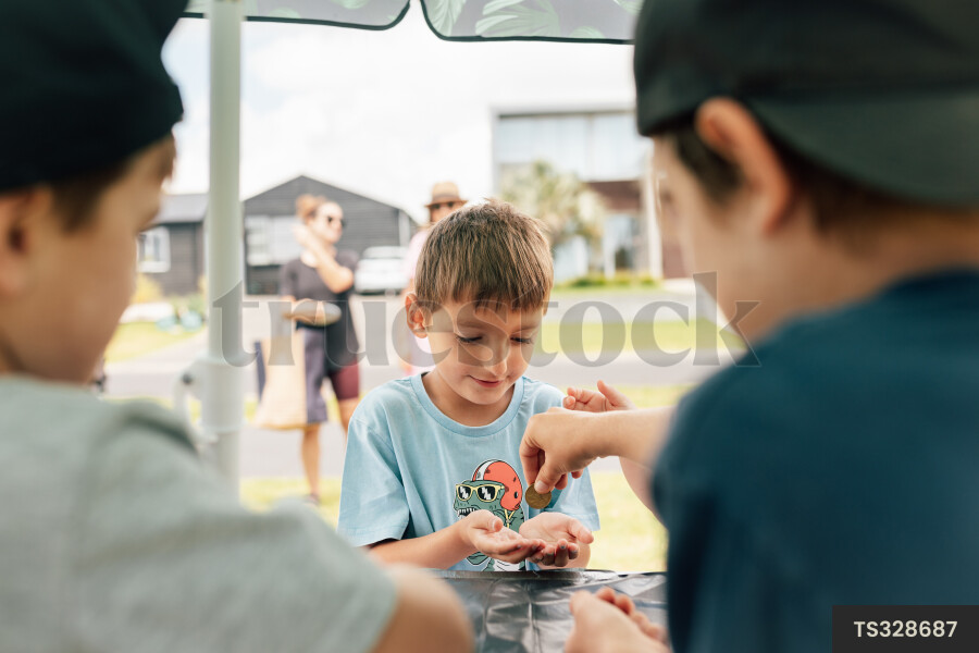 Kids Buying Lemonade at Lemonade Stand