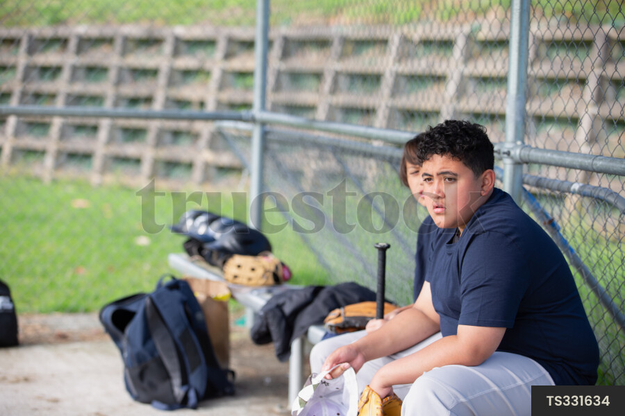 Players on Bench Waiting to Bat