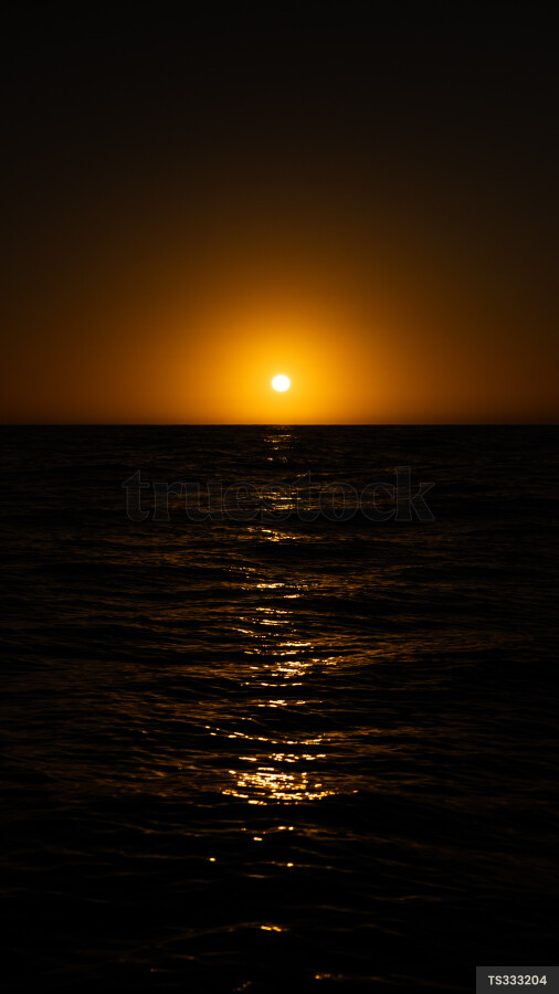 Sunset over sea in Haast