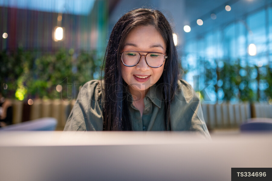 Woman Using Laptop for Work