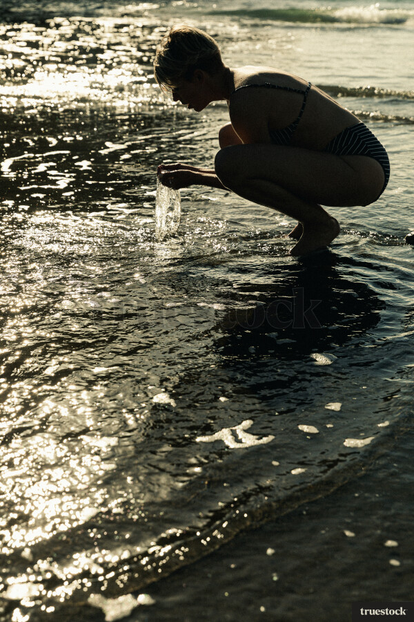 Woman Swimming at Piha Beach