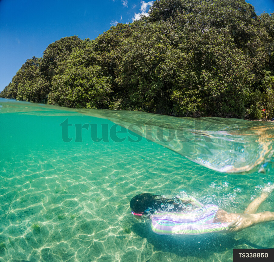 Girl swimming underwater