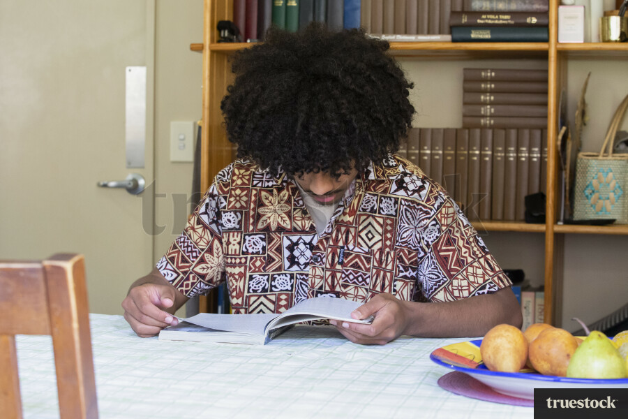 Boy Reading Textbook