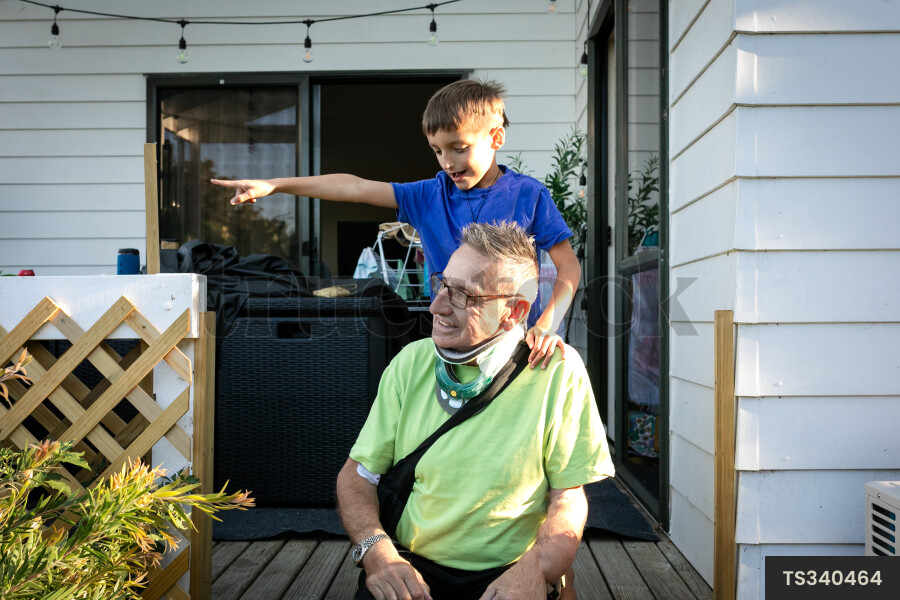 Smiling man with his grandson