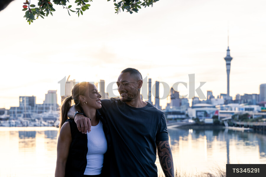 Couple by Auckland City at sunset