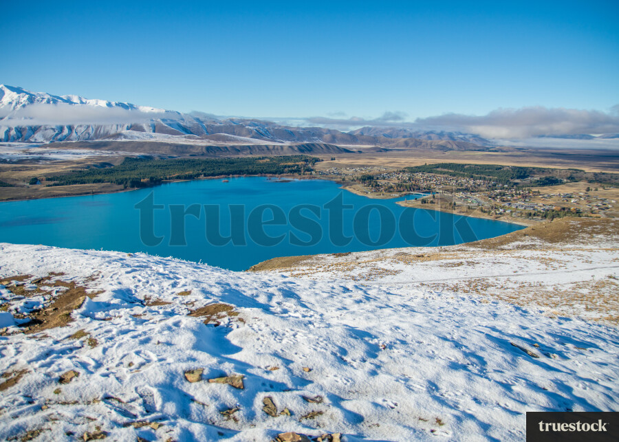 Mountains covered in snow and lake