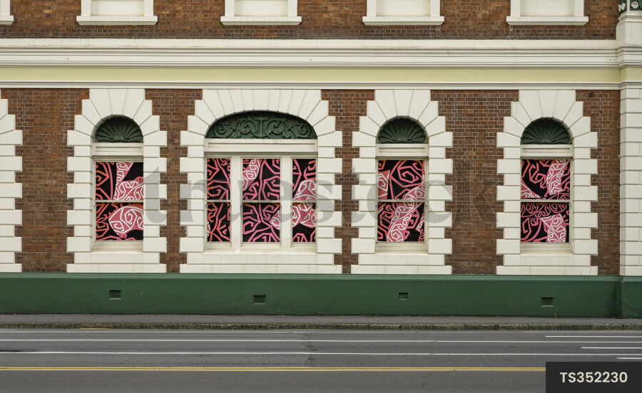 Street outside building with arch windows