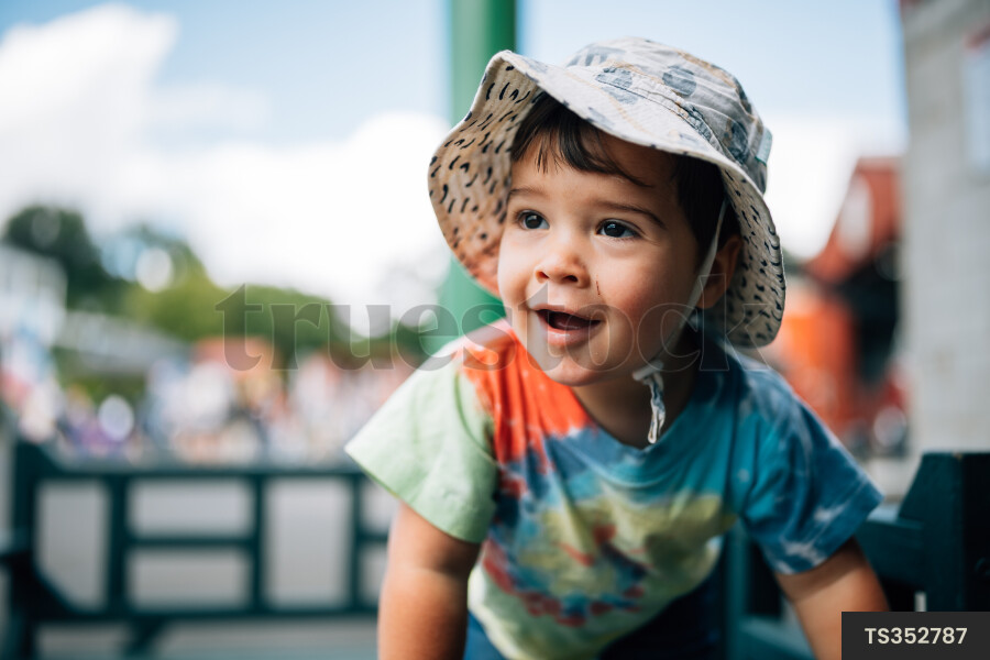 Young Boy Outside in Hat