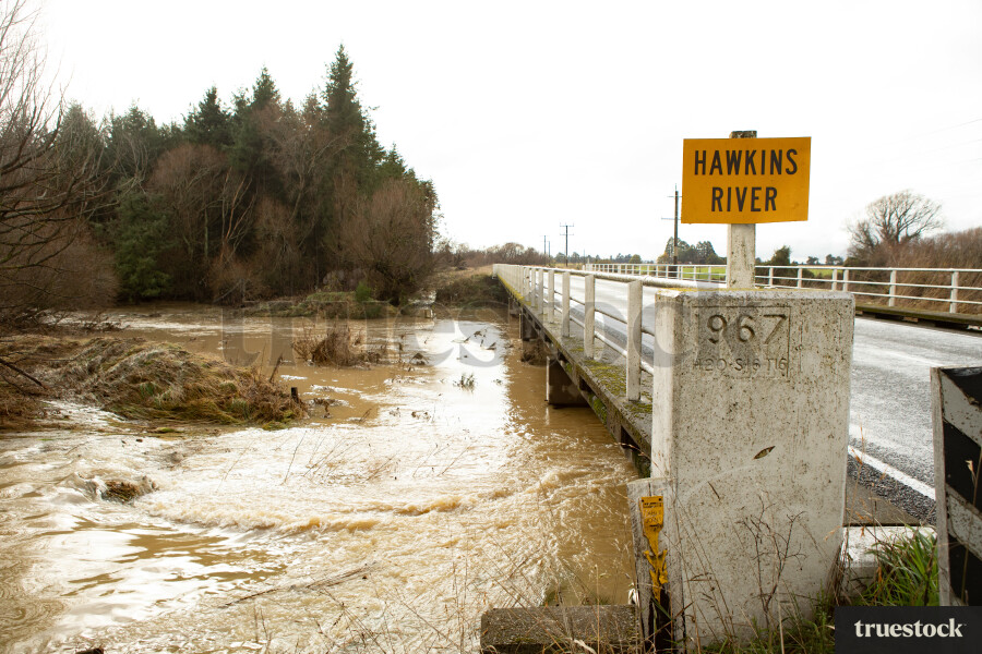 Rising river water and debris from flooding