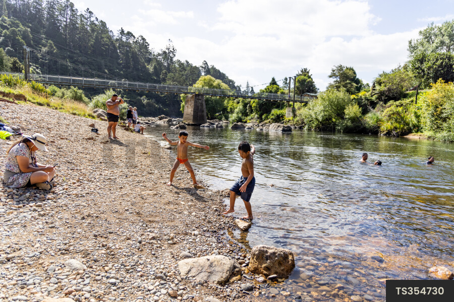 Family on riverbank