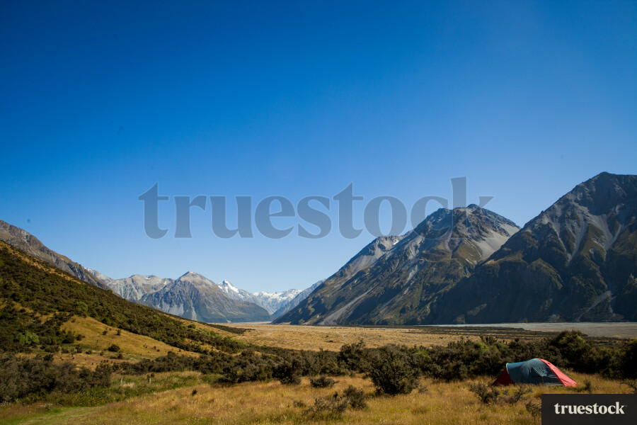 Tent in a remote spot near mountain ranges