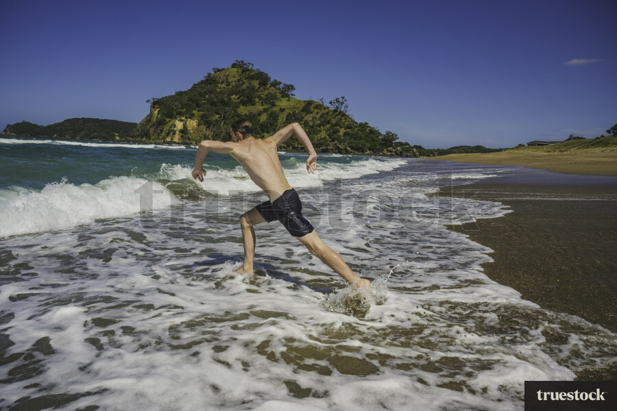 Guy Swimming at the Beach