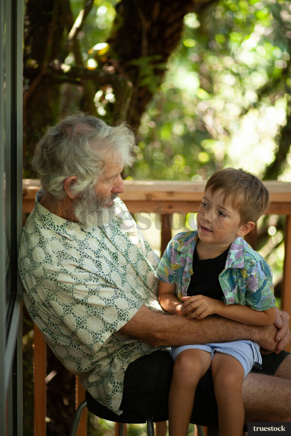 Grandfather and grandson talking