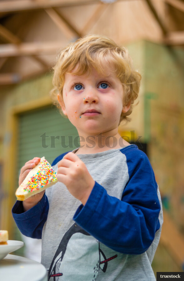 Toddler eating fairy bread