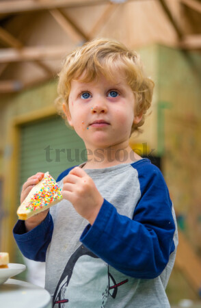 Toddler eating fairy bread