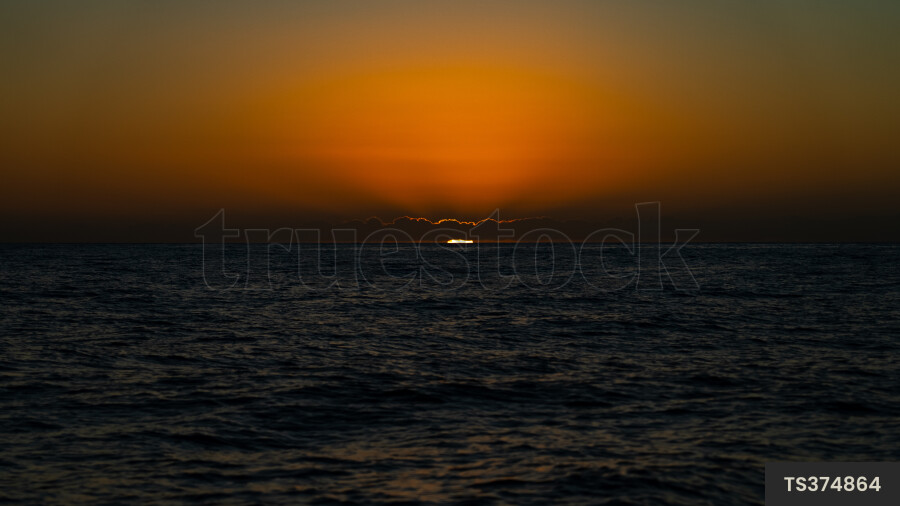 Sunset over sea in Haast