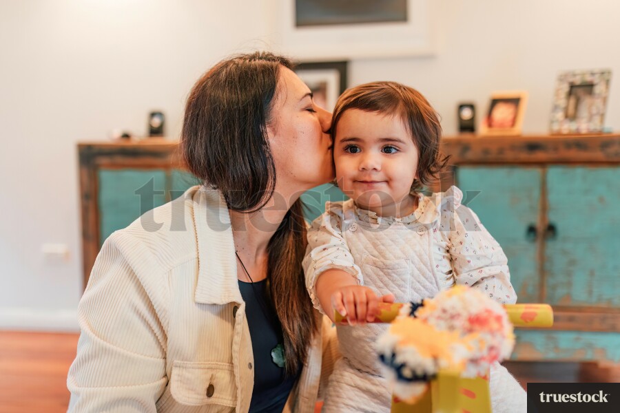 Daughter and Mother Playing on Wooden Toy