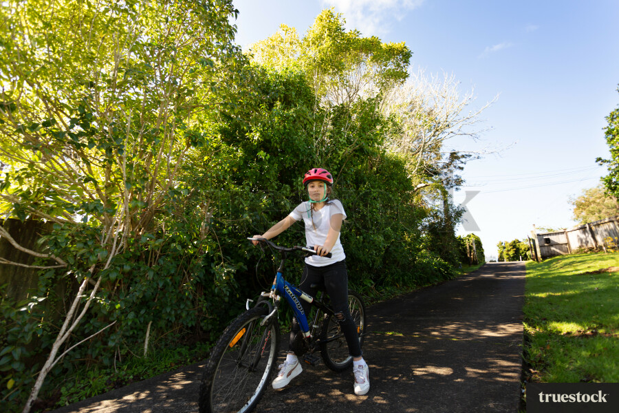 Young Girl Riding Bike
