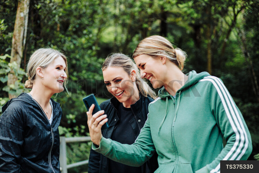 Women using Phone on Hike