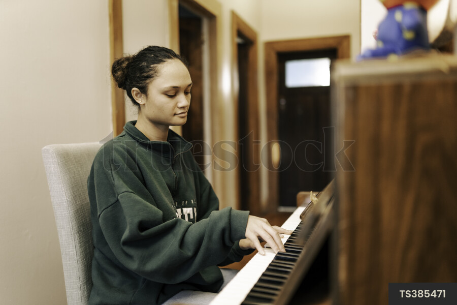 Teen Girl Playing Piano