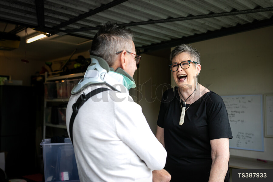 Health carer with patient in garage