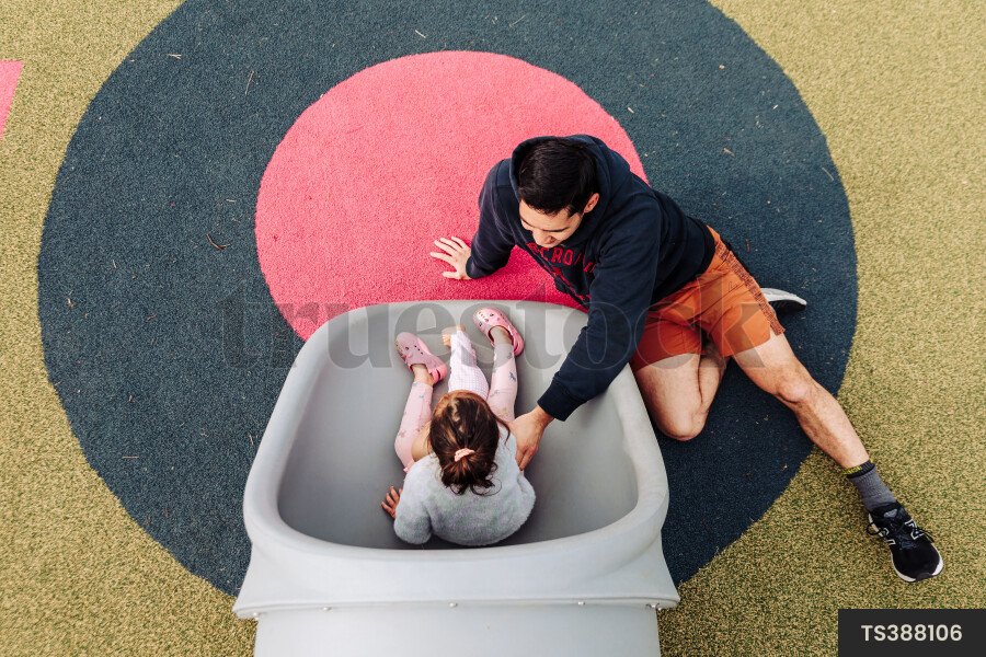 Young Girl on Slide at Park