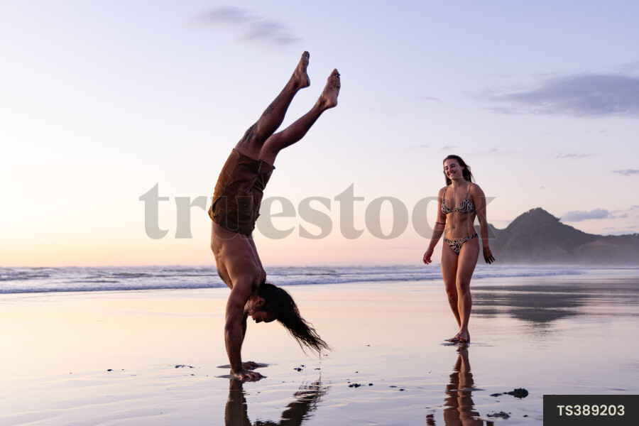 Couple on beach at sunset