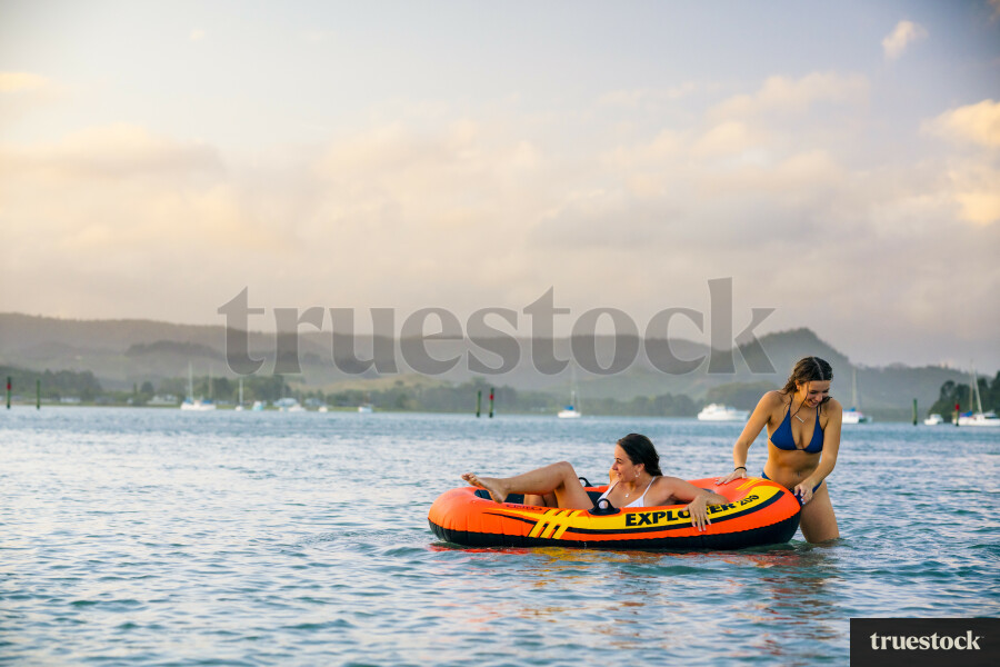 Woman Relaxing in an Inflatable Boat