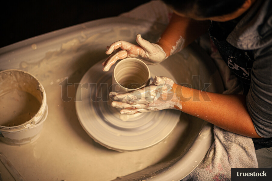 Woman making pottery
