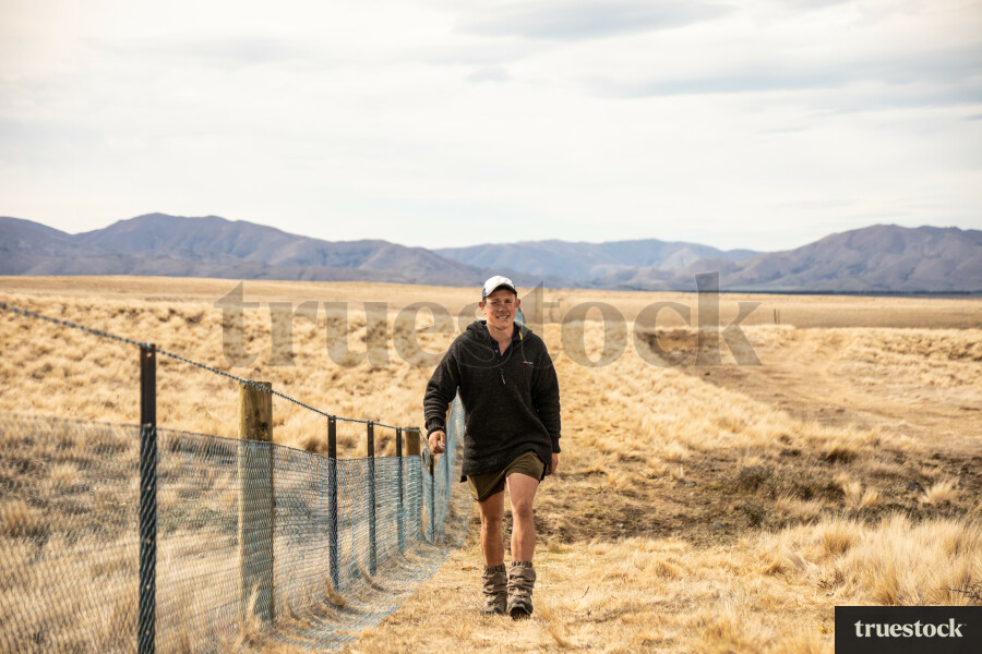 Fencer Walking Along Fence