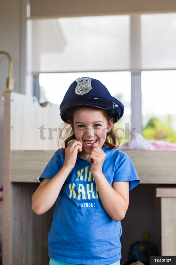 Young Girl in Police Hat