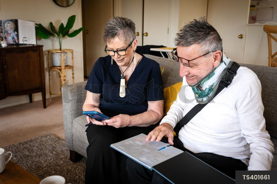 Health carer and patient with photo album