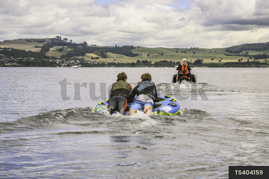 Teenage boys biscuiting on Lake Taupo