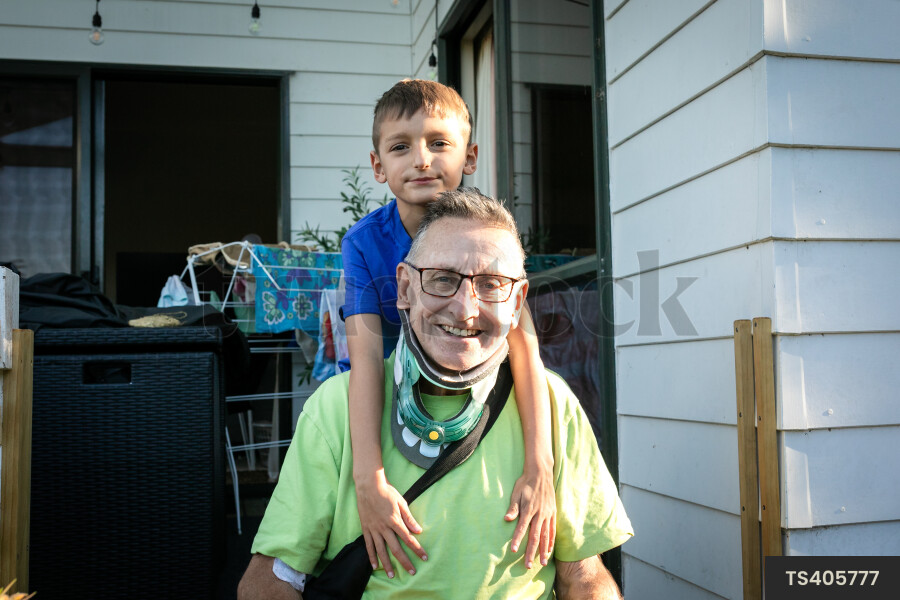 Smiling man with his grandson